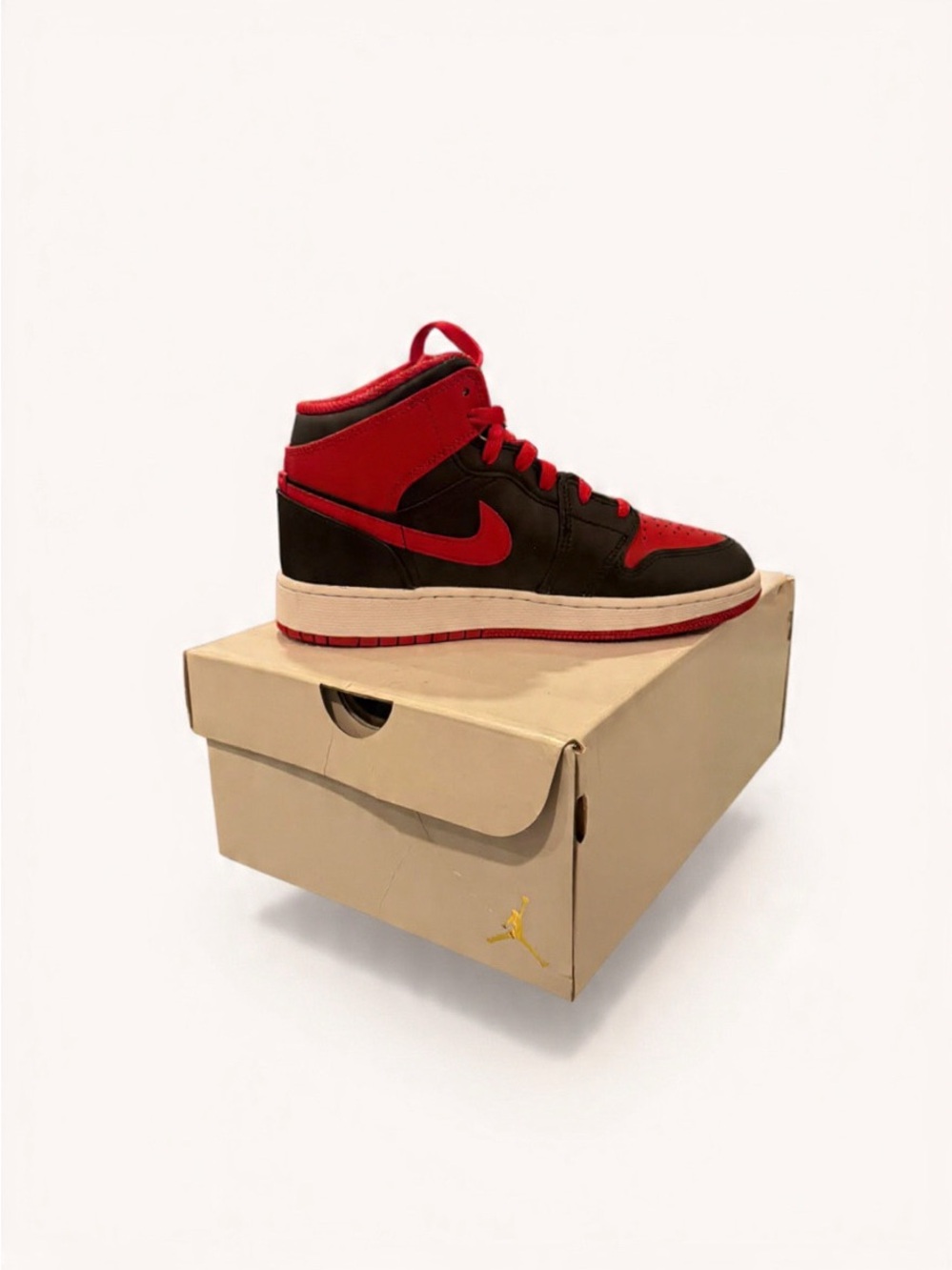Jordan Men’s Mid-Top Sneaker in Black and Red